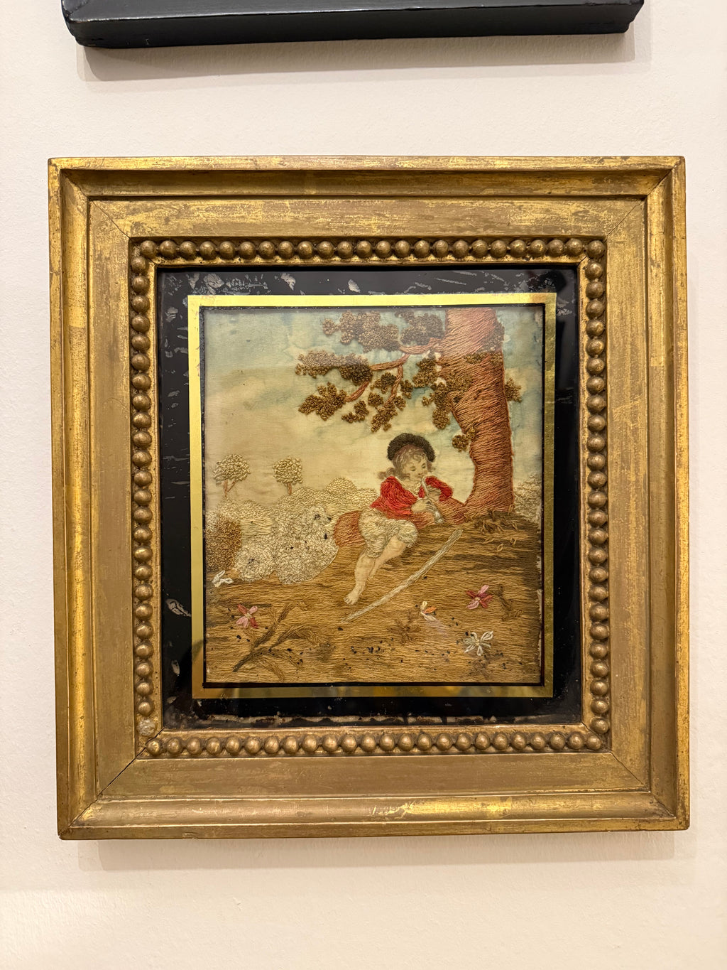 Late Georgian silkwork in original frame