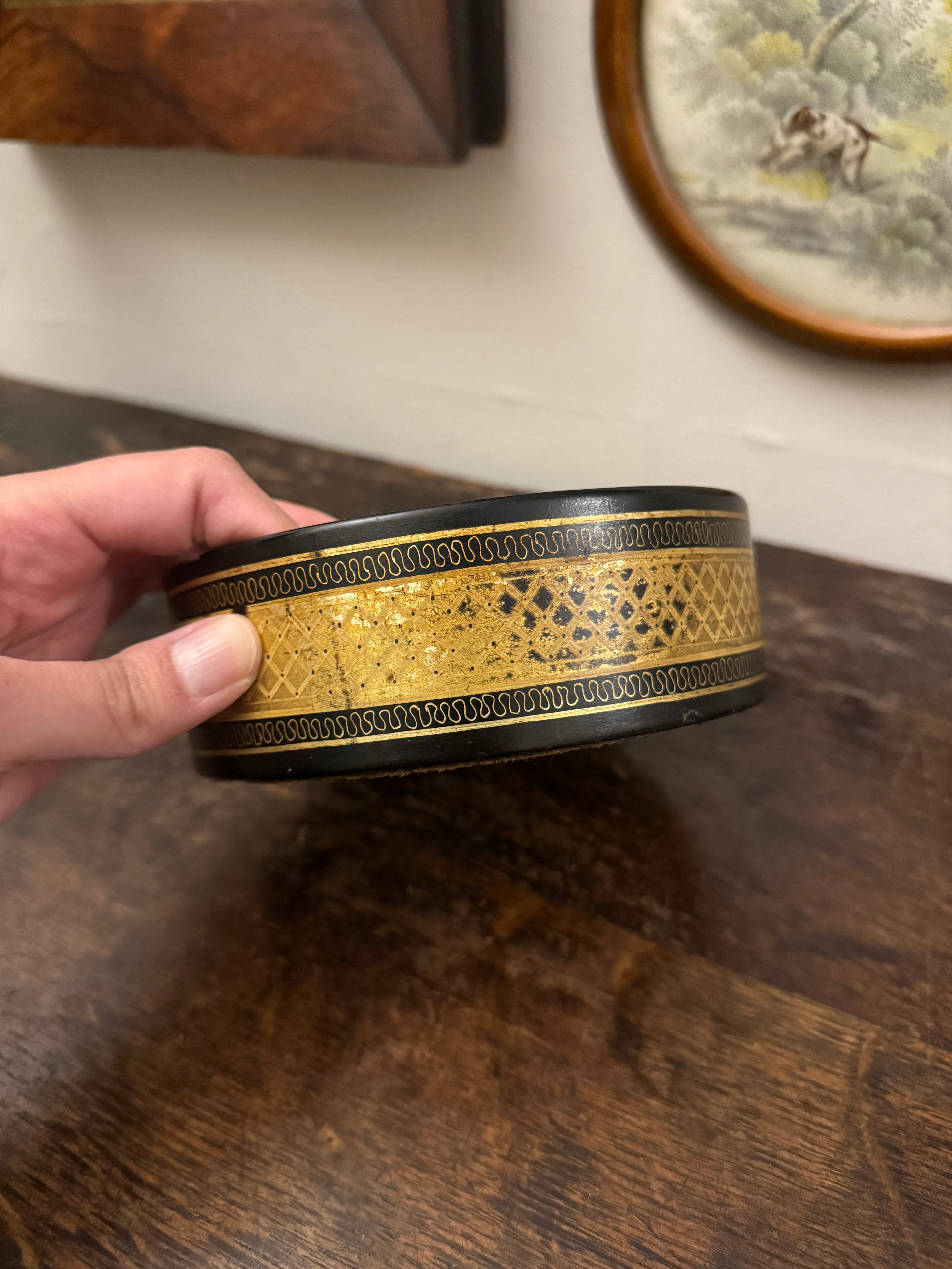 Late Georgian gold Papier Mache wine coaster