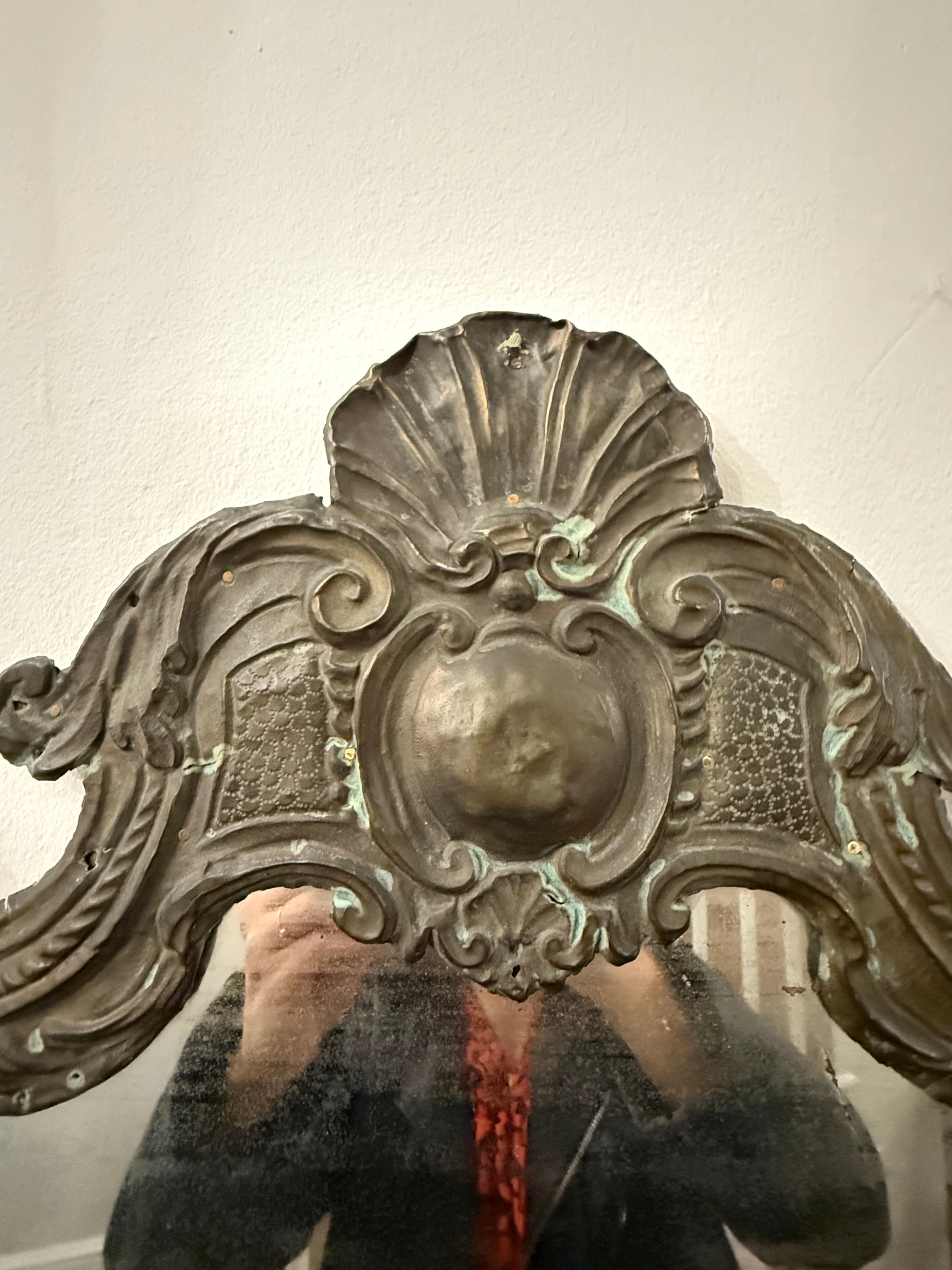 Antique hammered metal frame foxed dark mirror