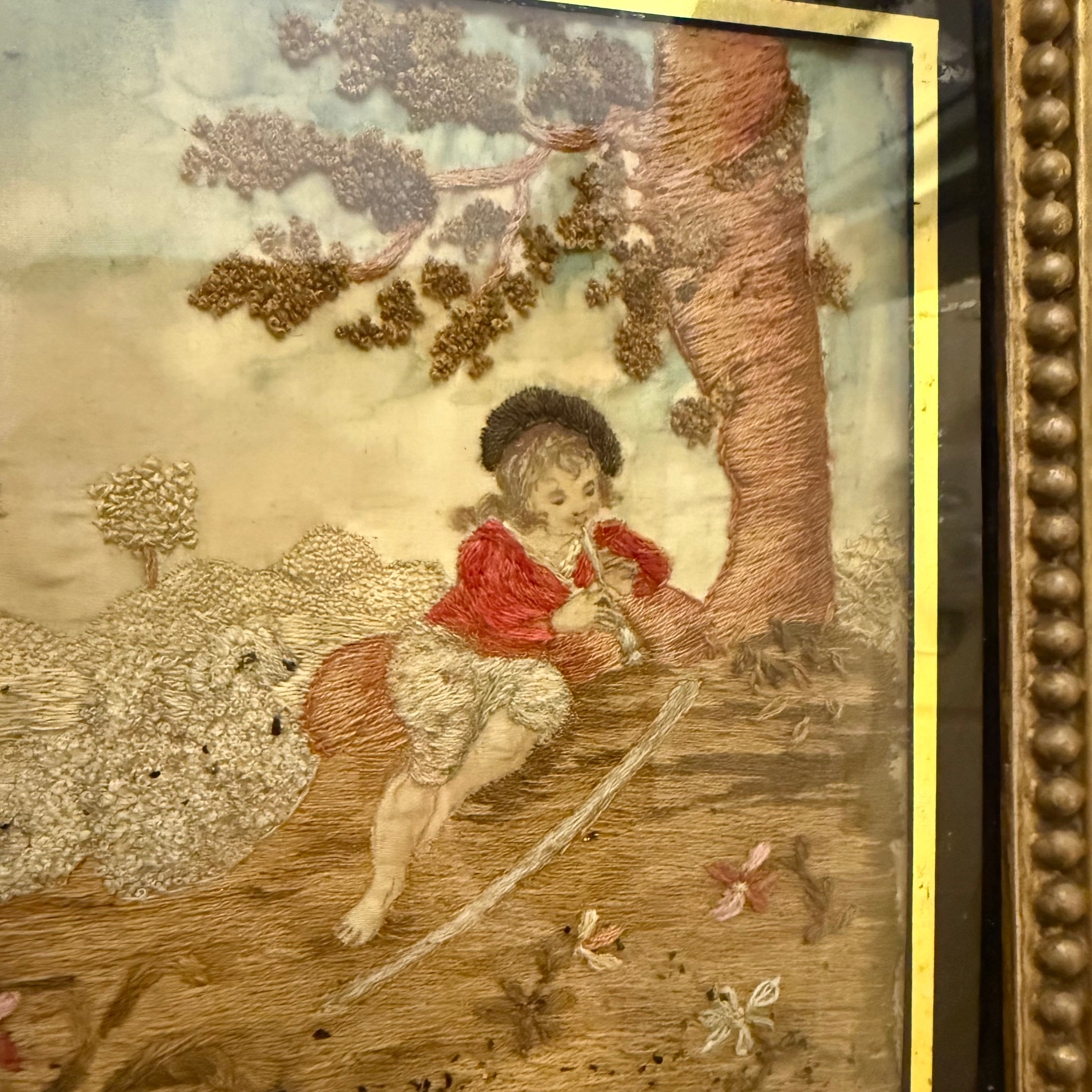 Late Georgian silkwork in original frame