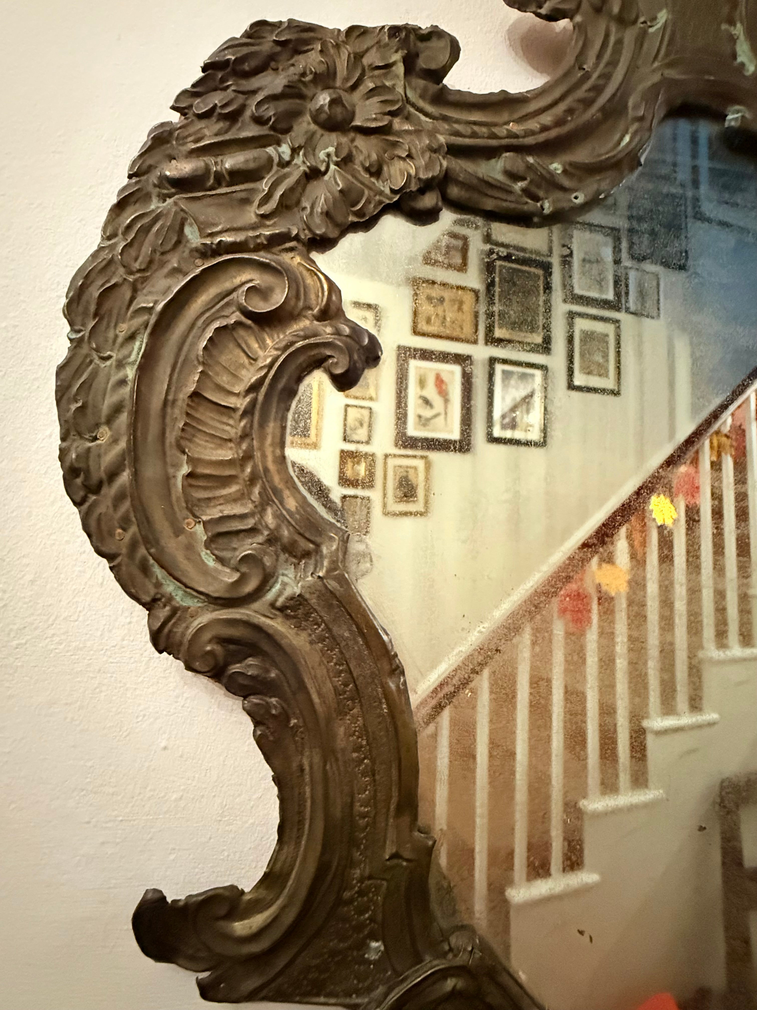 Antique hammered metal frame foxed dark mirror