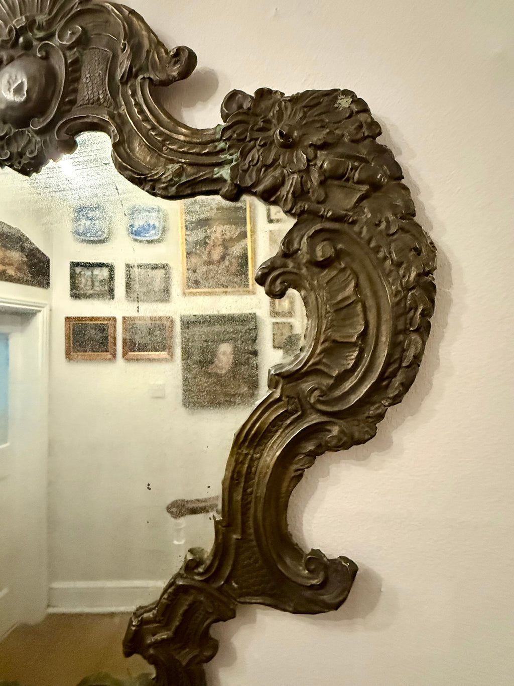 Antique hammered metal frame foxed dark mirror